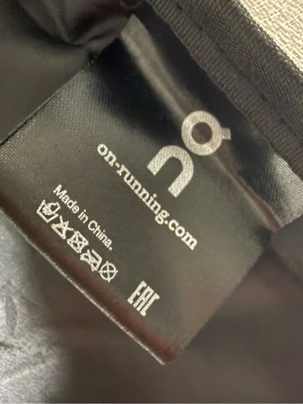 On Running Black Roll-Top Backpack with White Logo